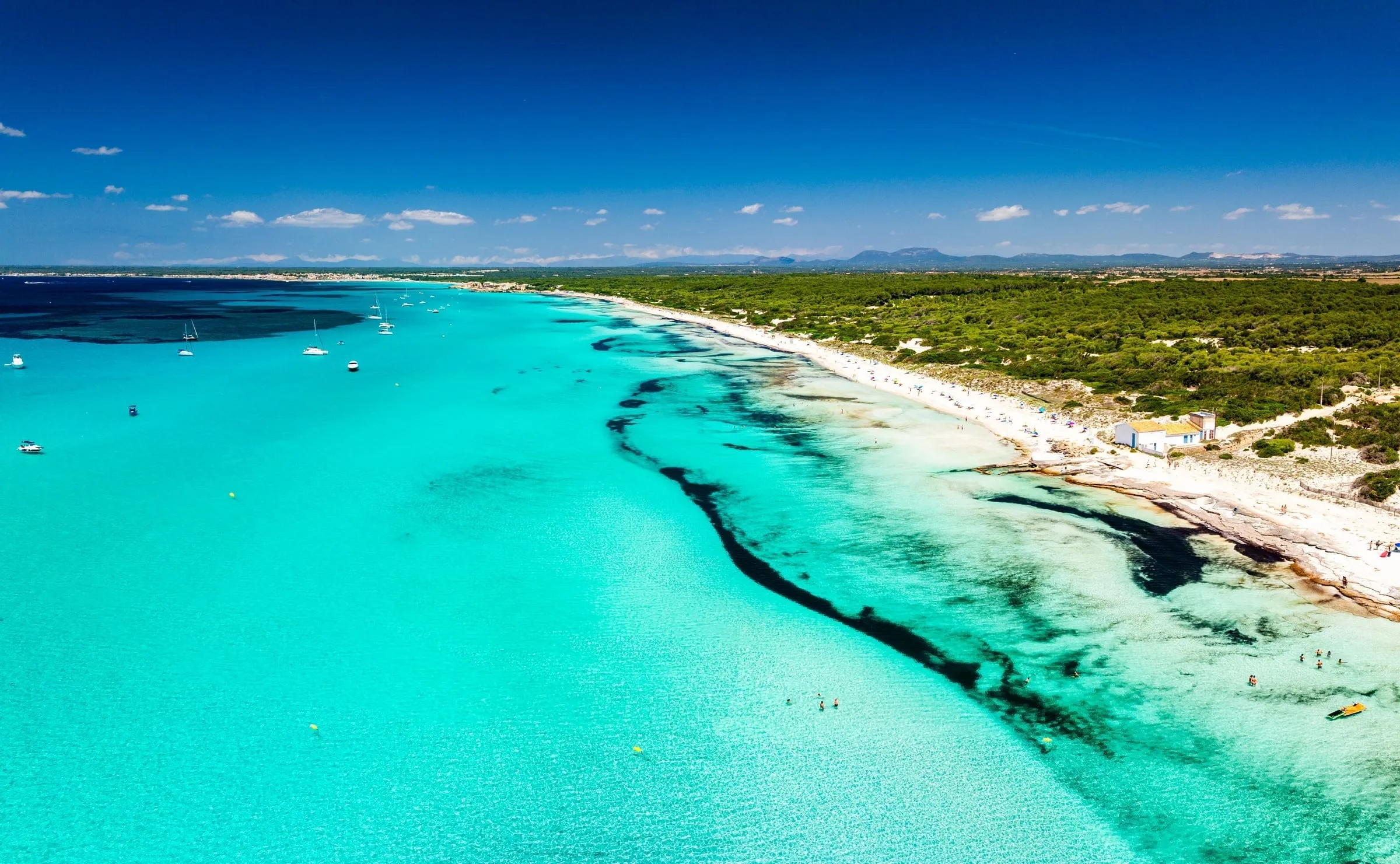 Es Trenc beach aerial view showing turquoise water and white sand