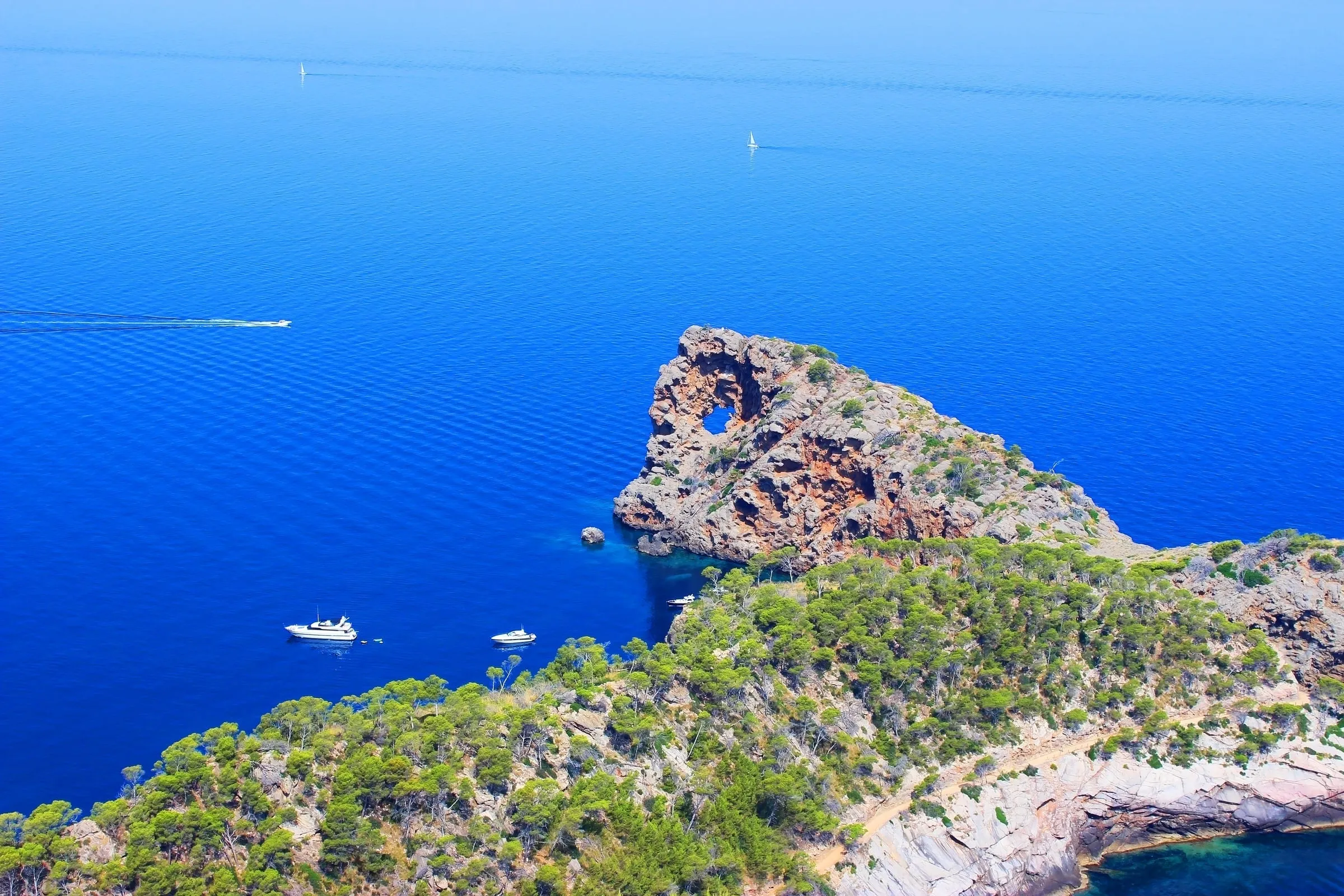 Sa Foradada rock formation with hole through peninsula