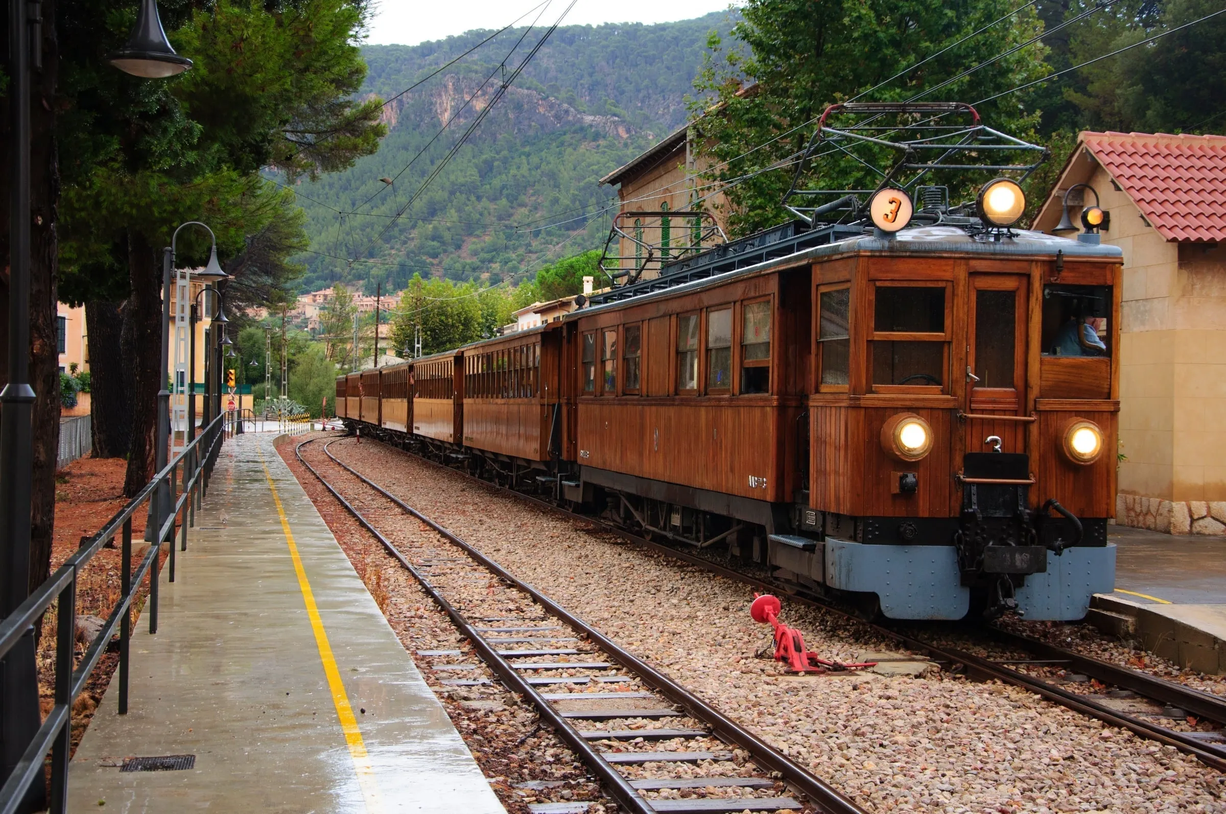 The historic Sóller train winding through citrus groves