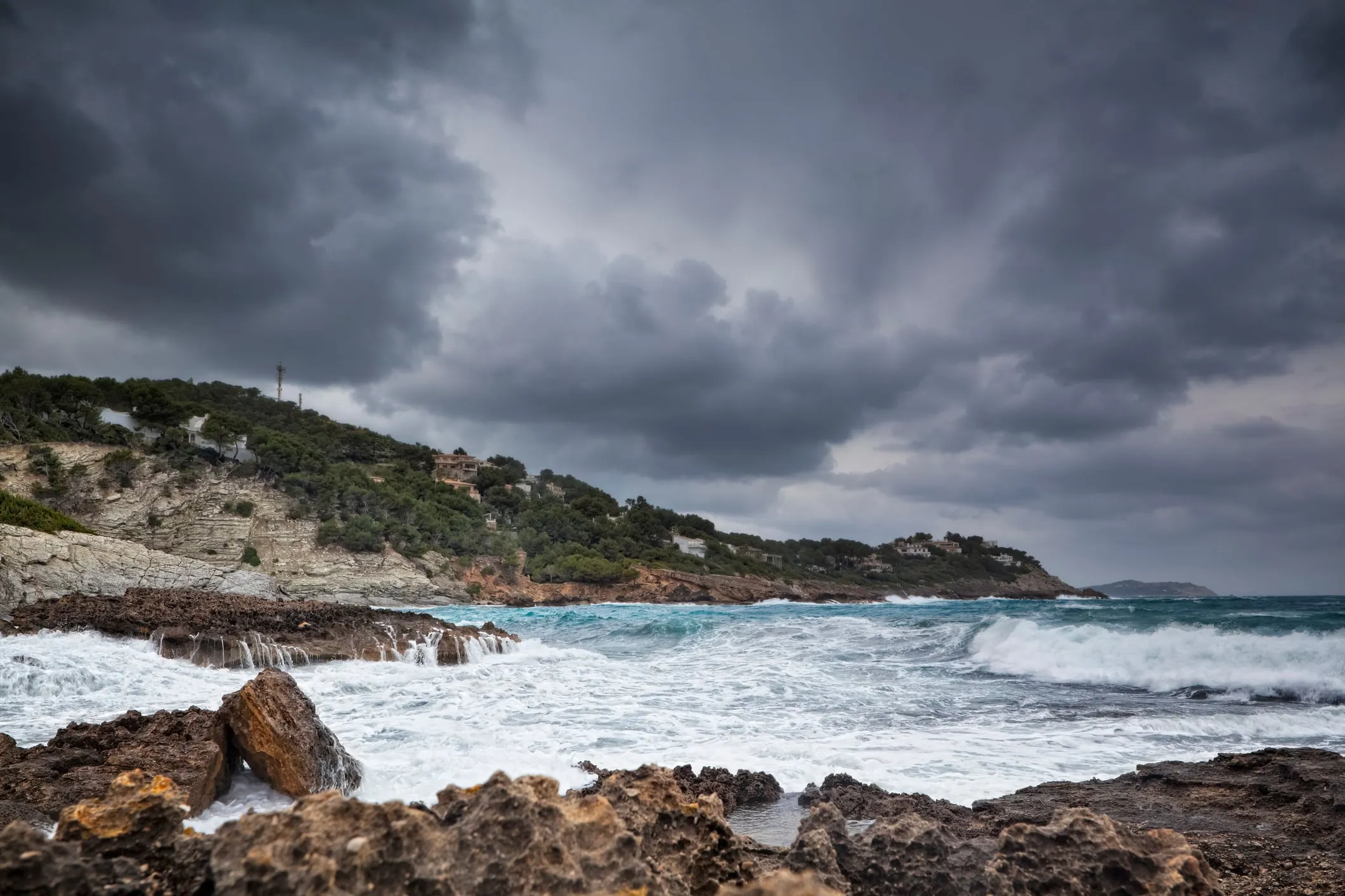 Massive waves crashing over Palma's waterfront promenade during a winter storm